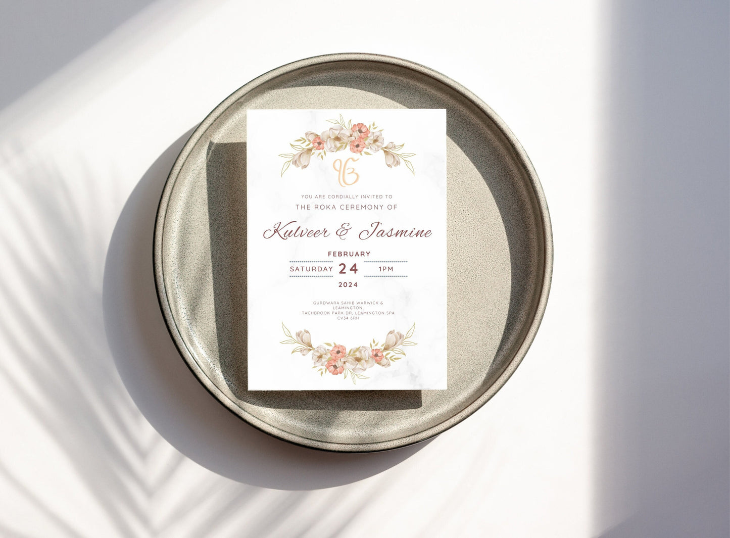Elegant neutral beige floral themed Roka invitation for couple. Flower graphic is centered top and bottom. The invite looks elegant and minimalist and contains all the text for the date time and location of event. Can edit all details on Canva.