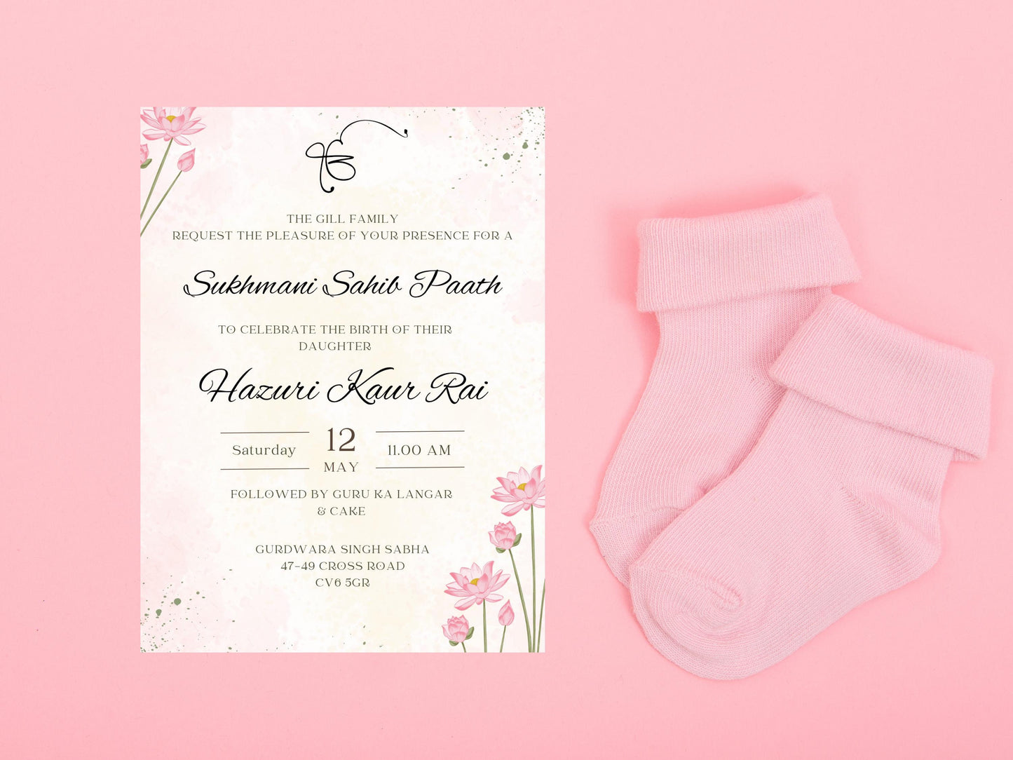 Elegant pink and green floral themed portrait invitation to Sukhmani Sahib Paath for the birth of a daughter. Pink flowers in top left corner and bottom right with green accents. Centre contains the text for the date time and location of event