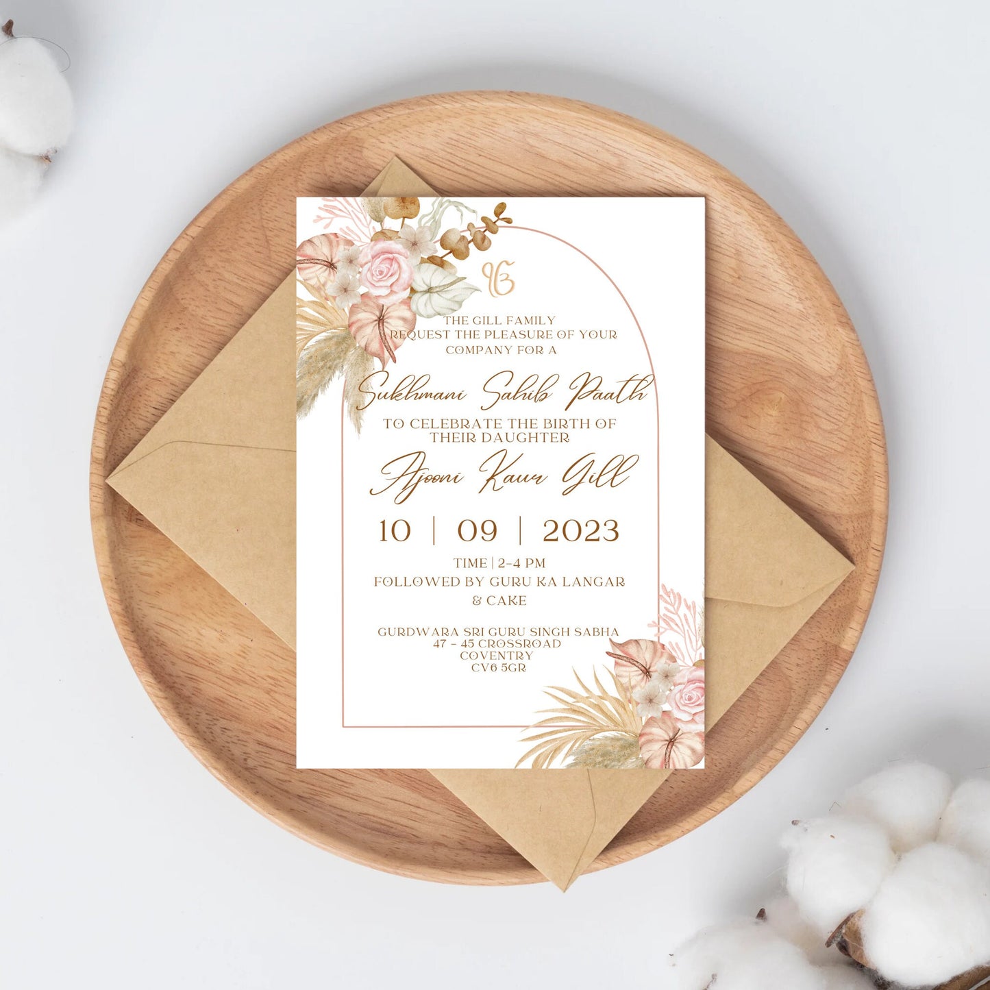Elegant pink and beige floral themed portrait invitation to Sukhmani Sahib Paath for the birth of a daughter. Pink & beige flowers in top left corner and bottom right with a gold arch which contains the text for the date time and location of event